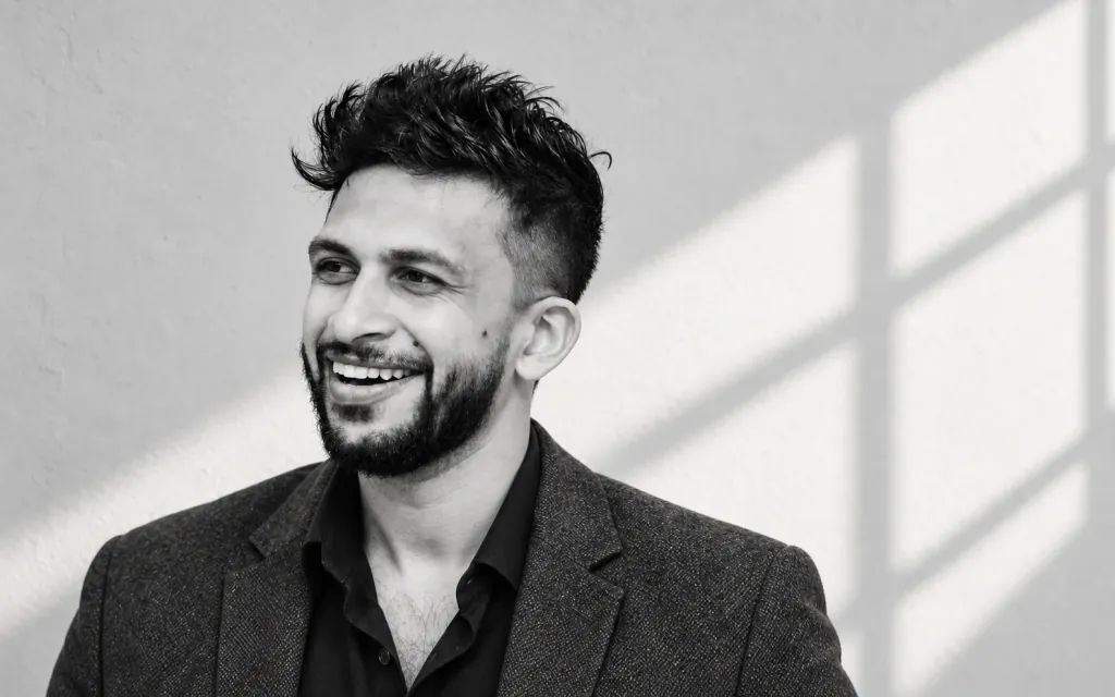 Ishan Madhusanka smiling in soft window light